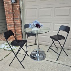 MODERN ROUND TABLE AND 3 BAR STOOLS IN GREAT CONDITION IDEAL SMALL ROOM. GLASS TAKE APART EASILY