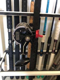 Sabre Jigstick/Newell Reel