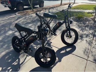 Pair of moped style e-bikes one large size and one medium size