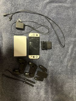 Nintendo Switch OLED with accessories + games
