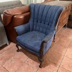 vintage or antique armchair, possibly in the Victorian or French Louis XV style, featuring a blue upholstered channel or fan back and ornate dark wood