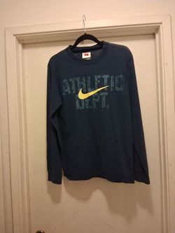 This is a Nike "Athletic Dept." long-sleeve t-shirt in navy blue with a yellow swoosh logo