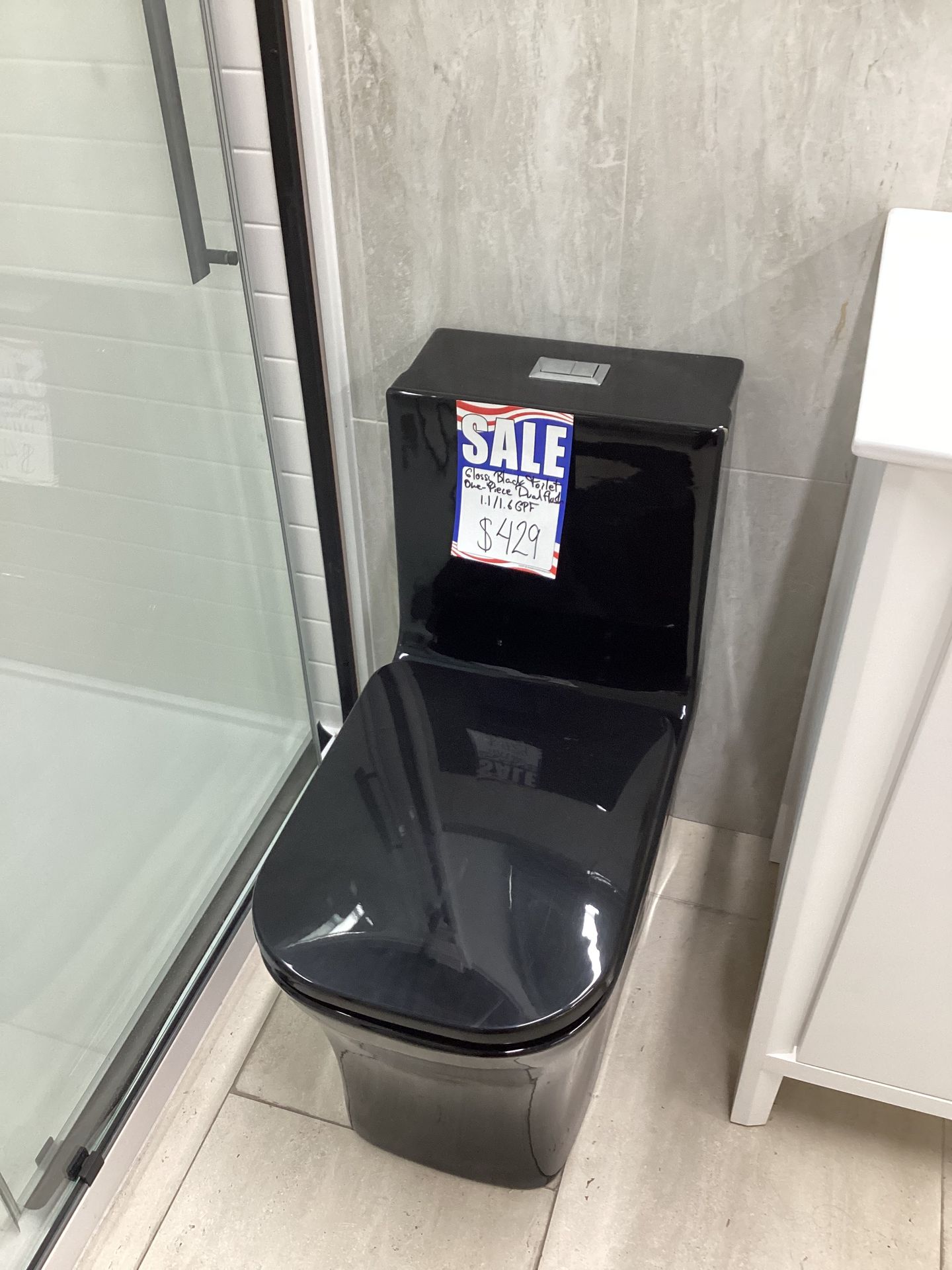 One piece toilet black modern design with dual Flush system fully skirted strong powerful flush system ready for pick up today