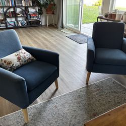 Pair of blue upholstered armchairs