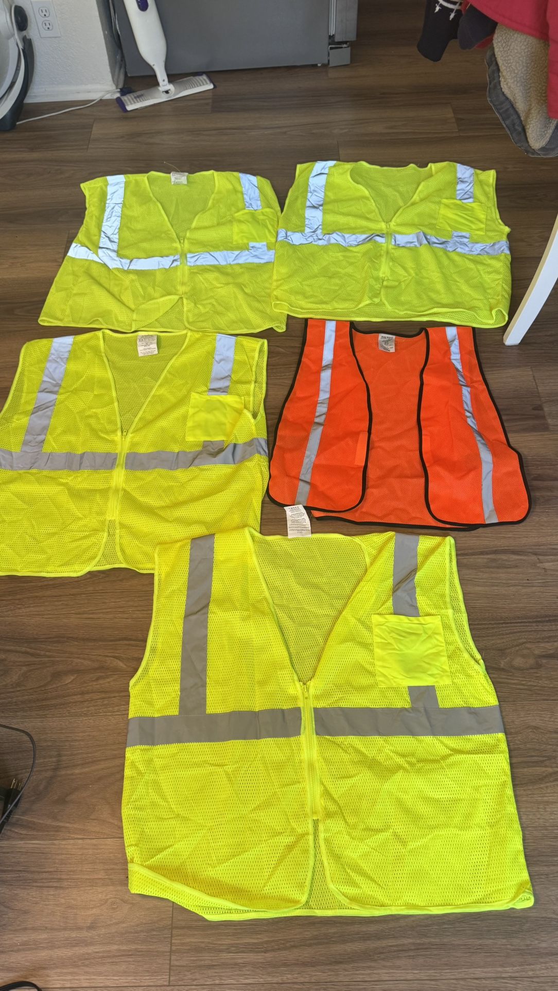 Five safety vest four of them are XL’s and One Is One Size Fits All