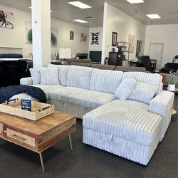 Double chaise sectional with sleeper and storage