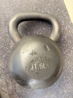 Heavy cast iron  rubber coated kettlebell weighs 61.6 lbs. This black Onnit weight has a wide handle.
