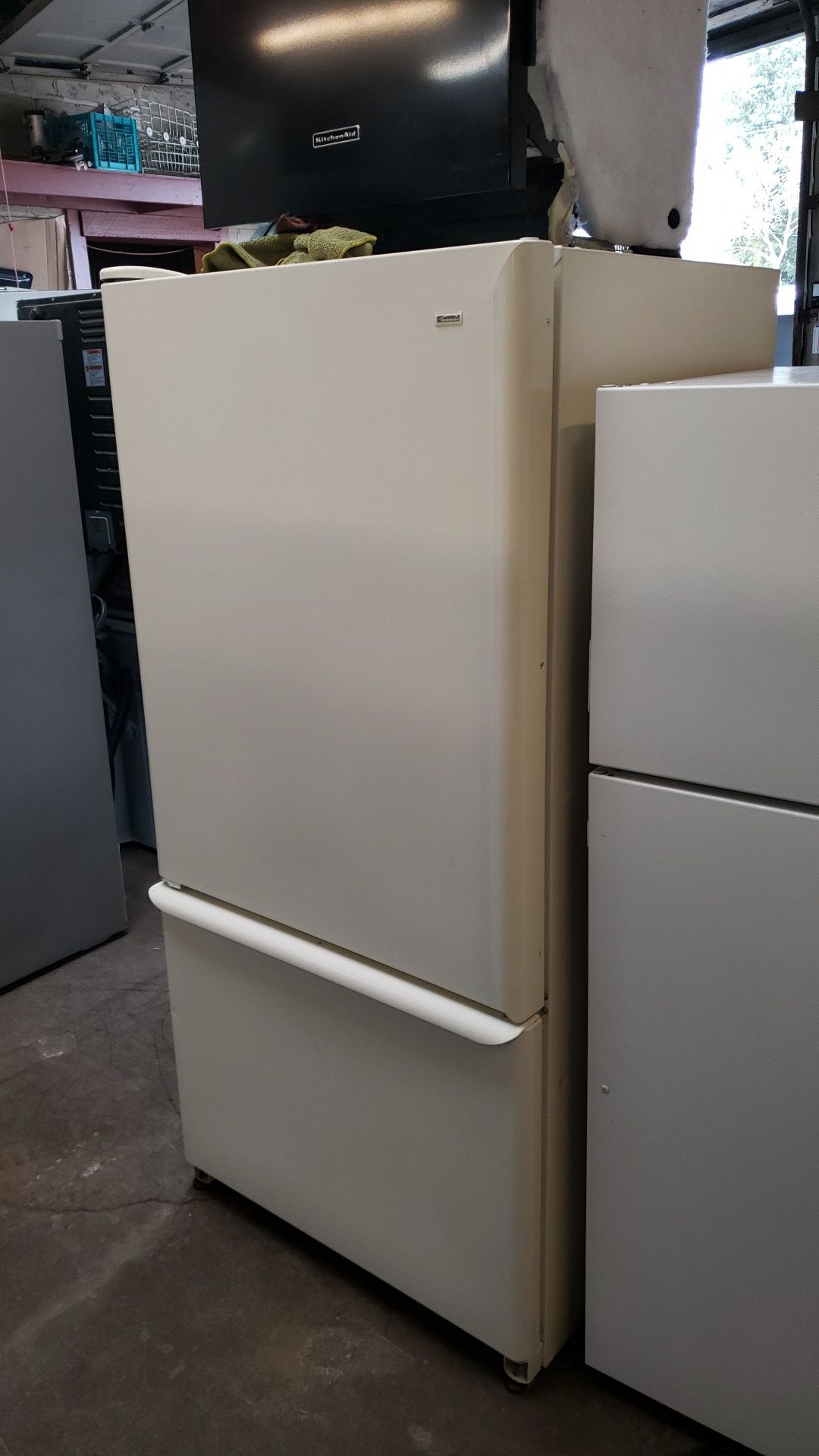 Kenmore Refrigerator with Ice maker bottom freezer Adjustable glass shelves Bisque