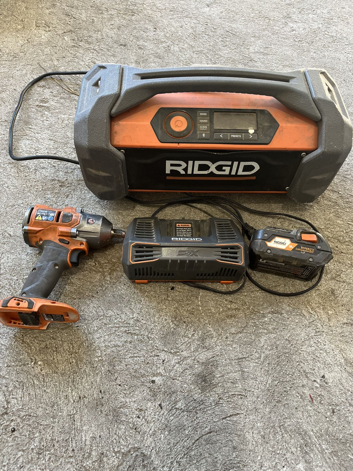 RIDGID Battery, battery charger, radio, impacted