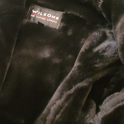 Blk Real leather Coat With hood. Inside Fur.