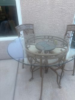 Tall glass dining table with chairs