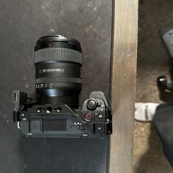 Zv-E1 mirrorless camera w/ cage & 24mm G-master f 1.4 Lens (And accessories)