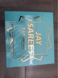 New JAY SAREES 7-1 Color LED Professional Light Therapy Mask is in its original plastic wrap. This device has seven light therapy modes: Red Light (63