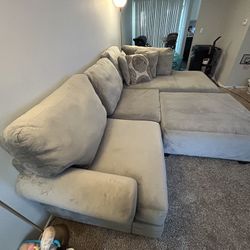 Grey sectional With ottoman