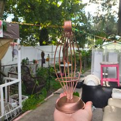 Copper-colored metal wire tea light candle holder