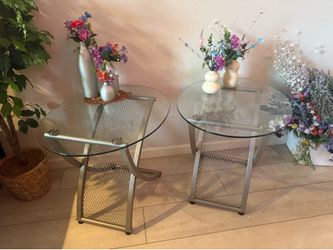 Two glass and metal framed side or end tables