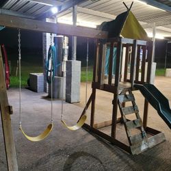 Outdoor Swing Set With A Slide 