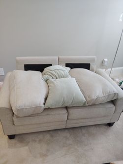 Beige sofa with cushions