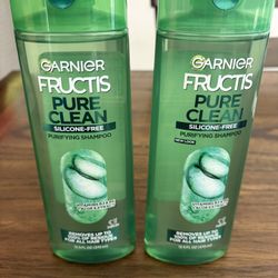 Two Full Size Garnier Fructis Shampoo