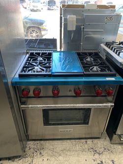 Wolf 36” slide in range with middle grill in stainless steel