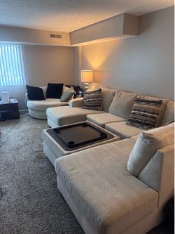 sectional with swivel chair and storage ottoman