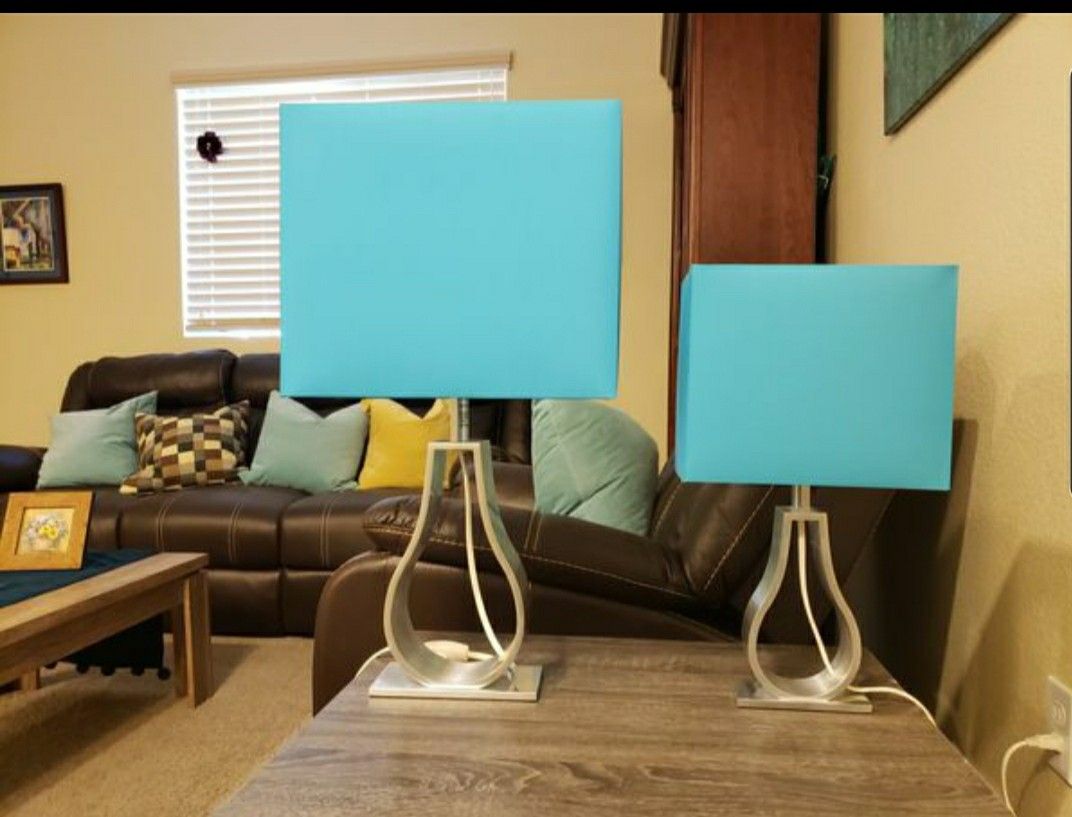 Set of two unique shape and color Scandinavian design table lamps.