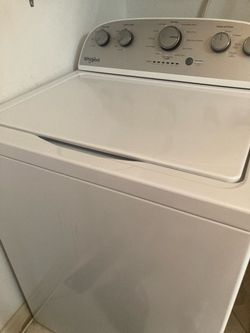 A set of whirlpool, washer, dryer, and refrigerator