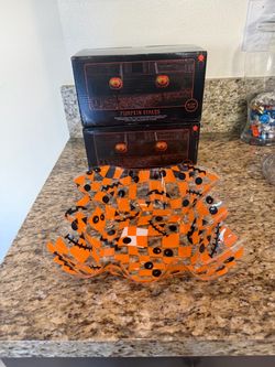 Pumpkins stakes with a candy bowl