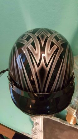 Motorcycle helmet. kool design...size small...Dot approved..Great condtion