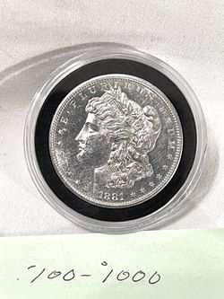 About uncirculated, sealed in  capsule 1881-S Morgan Silver Dollar. This is valued at $101 on US coin book.