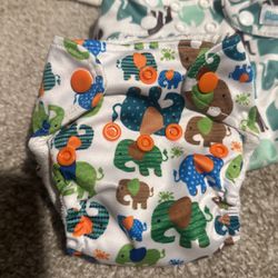 24 cloth diapers plus inserts and flats newborn to 2 years 