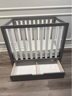 Mini Crib With Storage Drawer. Mini Crib Mattress included.