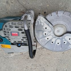 MAKITA concrete saw 14"  needs started pull cord  system   $250 obo make me a offer sold as is