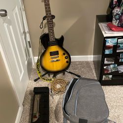 Guitar, Case, Wires, Custom Pedals, Capo, Tuner, And Stand.