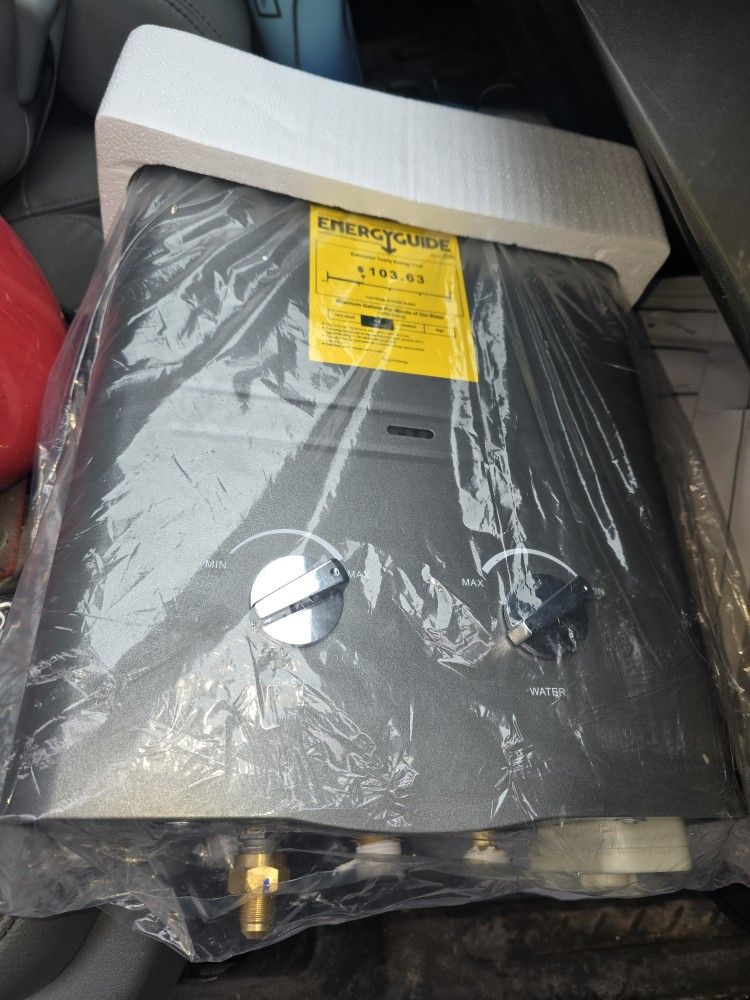 LP Propane Tankless Hot Water Heater With All The Connections And Water Hose