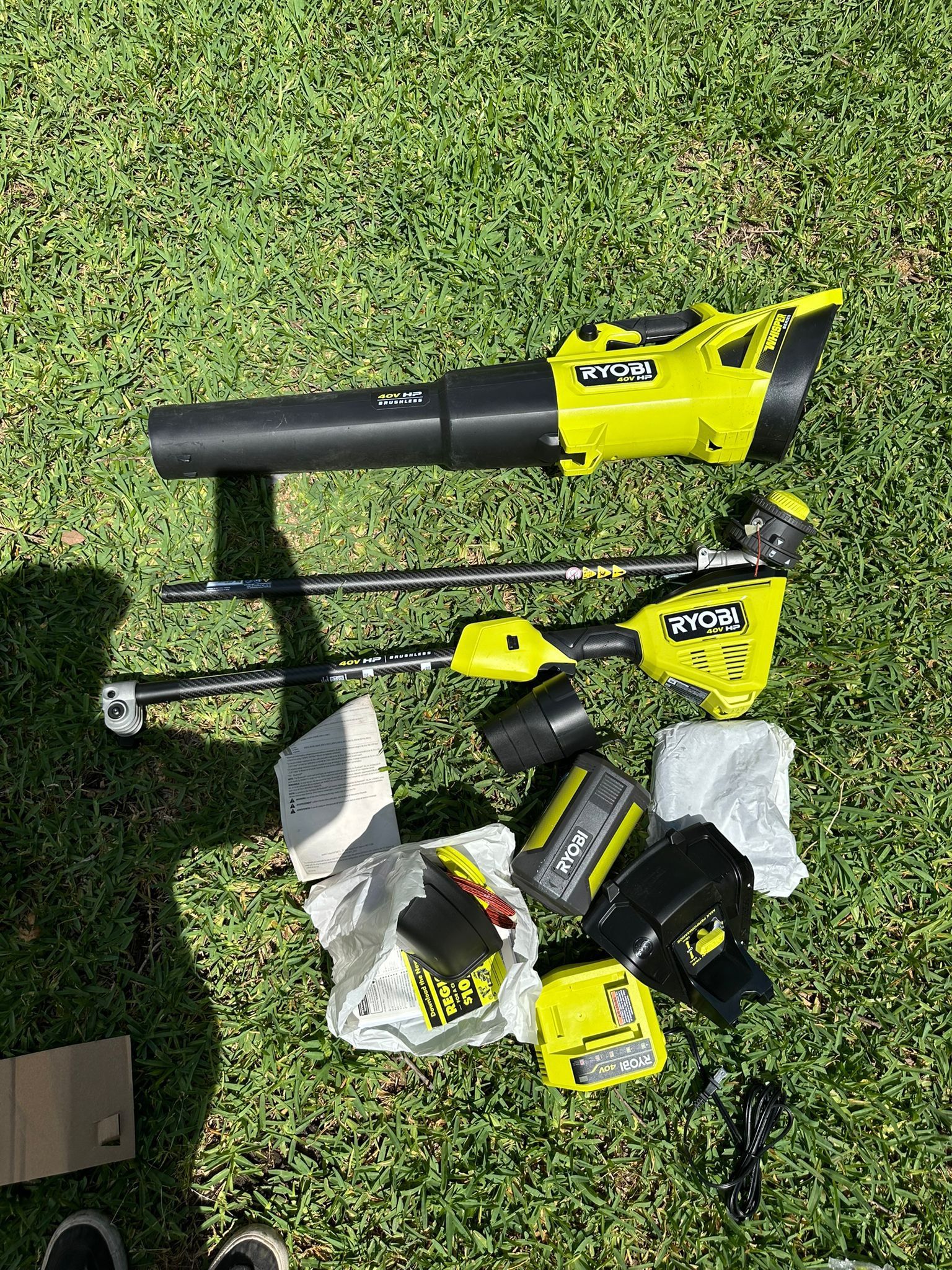 RYOBI 40V HP Brushless 600 CFM 155 MPH Cordless Leaf Blower and Carbon Fiber String Trimmer with 4.0 Ah Battery and Charger