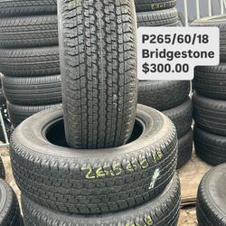 SET OF FOUR USED TIRES 265/60/18 BRIDGESTONE 