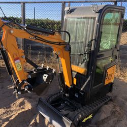 New mini excavator with an enclosed cab concrete breaker attachment available
