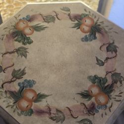 Cute wooden table with apples painted on it