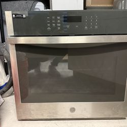 GE 30” built-in electric wall oven in stainless steel. Good condition, from storage. Retail price over $1,000.