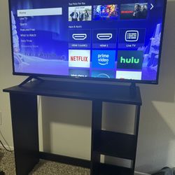 TCL Roku Tv and Shelf