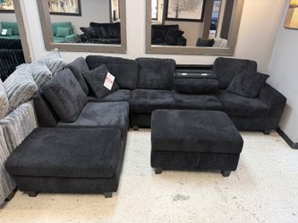Black Sectional And Ottoman 