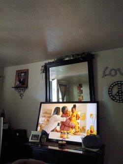 46 inch tv with black mirror teal Wood and black   TV stand with remote color is great