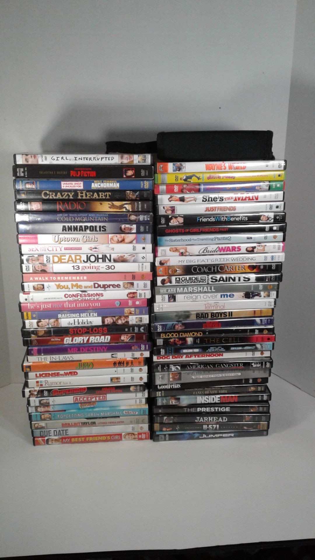 61 DVD Movies + loose discs in travel case