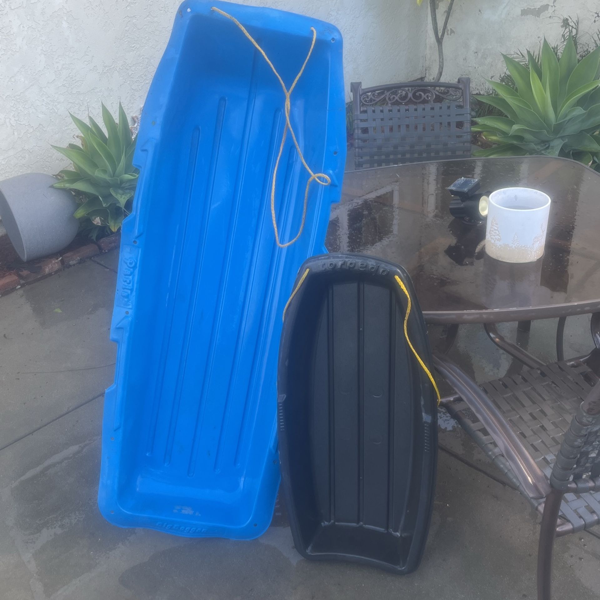 Two Plastic Toboggans