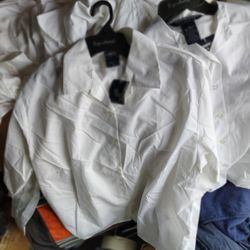 White dress shirts on hangers. 80 plus kid to teen shirts $50 for altogether. Located Mount Dora Fla 32757