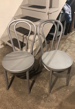 Pair of silver plastic dining chairs
