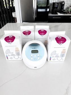 Spectra electric breast pump machine ( used) with 4 NEW kits