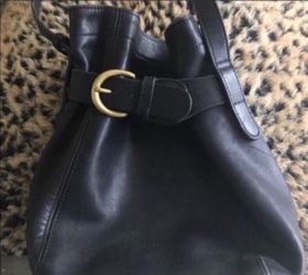 Coach black bucket Crossbody purse is 9X9 with a 20 inch adjustable drop strap great preowned condition