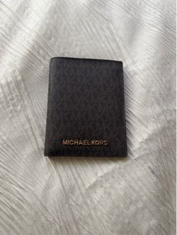 a MICHAEL Michael Kors black leather passport wallet
